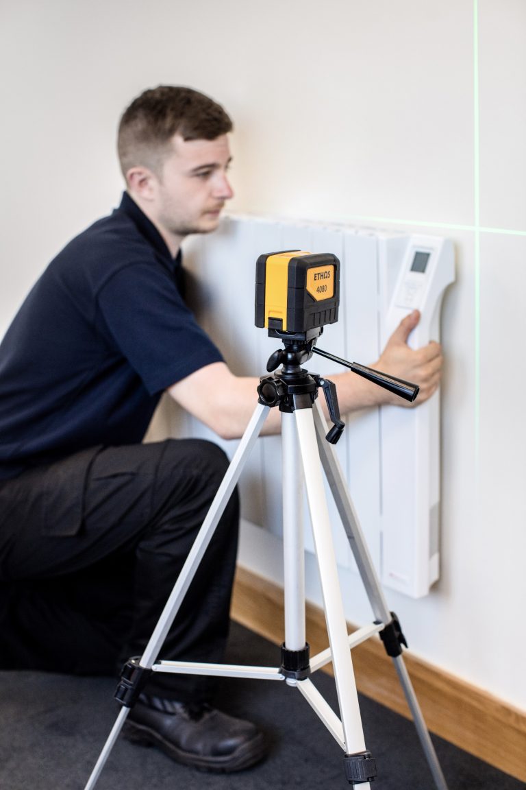 Photo of a workman installing a radiator